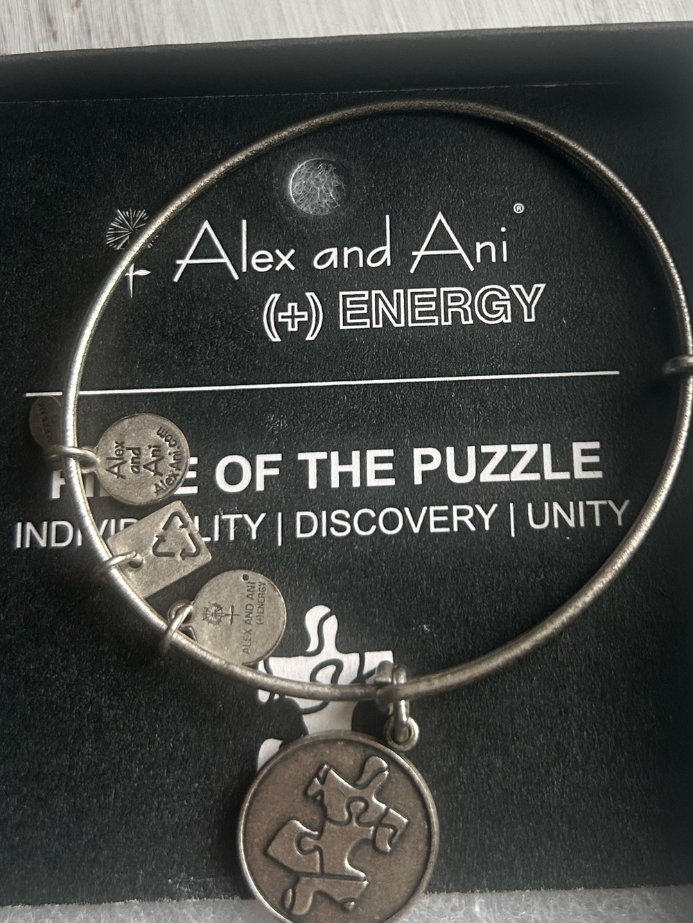 Alex and Ani Silver Puzzle Piece Energy Charm Bangle.